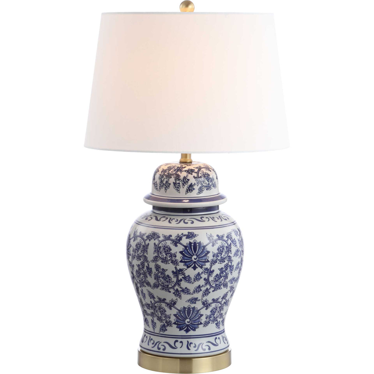 A softly glowing white shade tops a blue-and-white floral ceramic base with brass-tone details