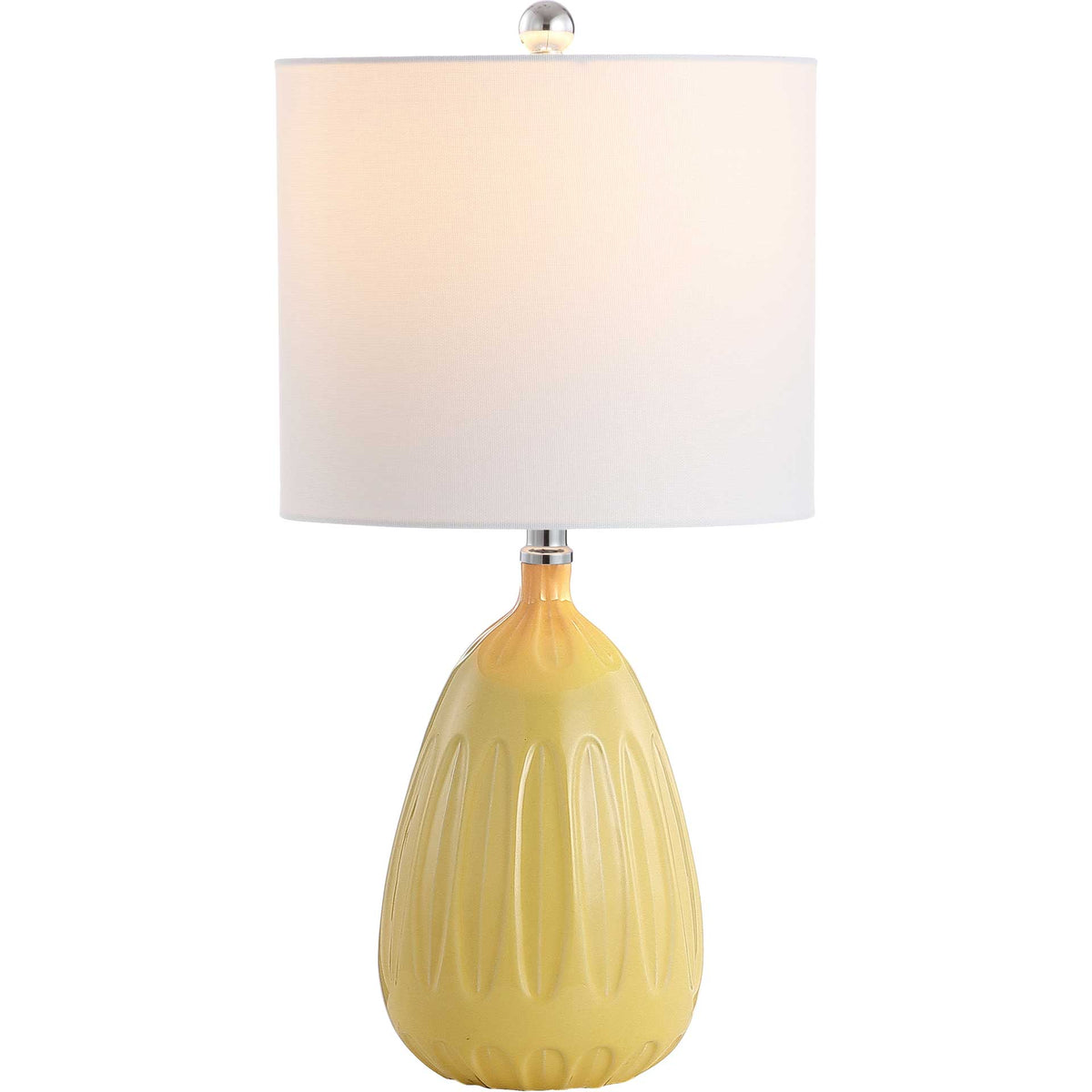 A warm glow lights the white shade above a sunny yellow ceramic base with sculpted accents.