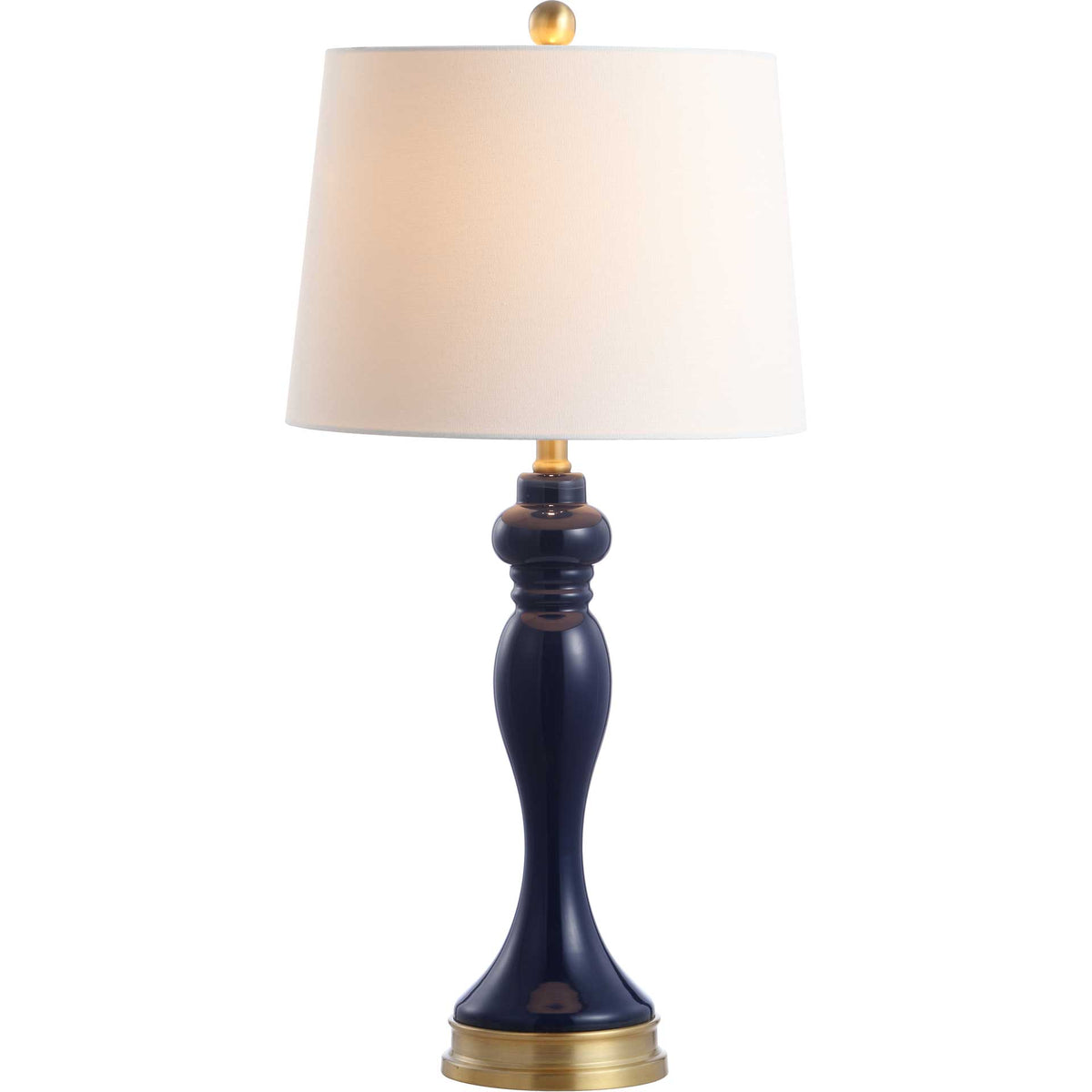 A softly glowing white shade tops a sculpted navy glass base with warm gold accents