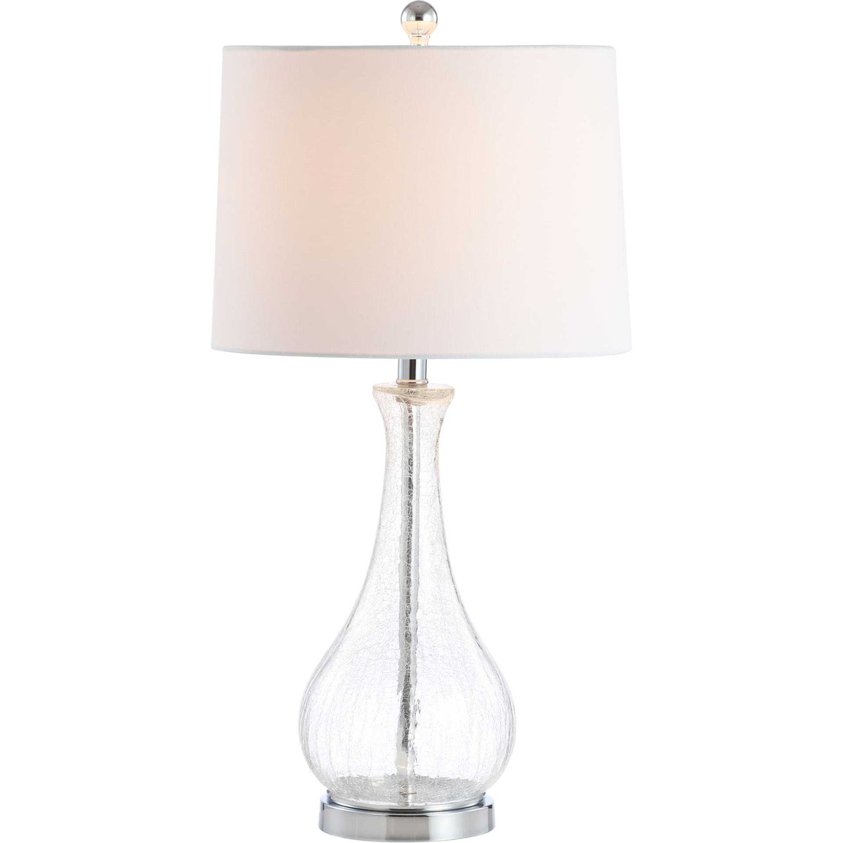 Warm light glows through the white shade above a textured glass base and gleaming chrome foot