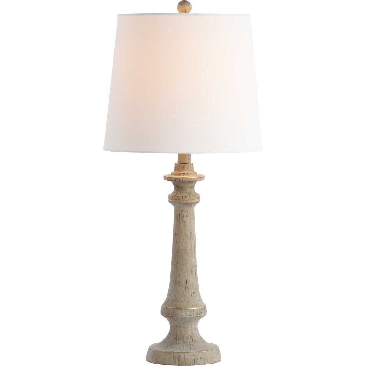 Carved wood-look base and white fabric shade cast a soft, warm glow
