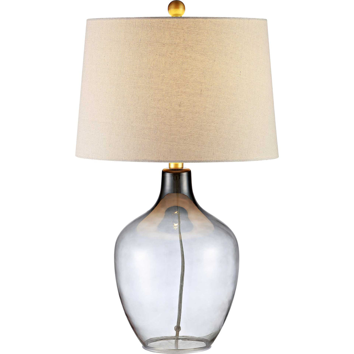 Warm light glows through the white fabric shade above a translucent gray glass base.