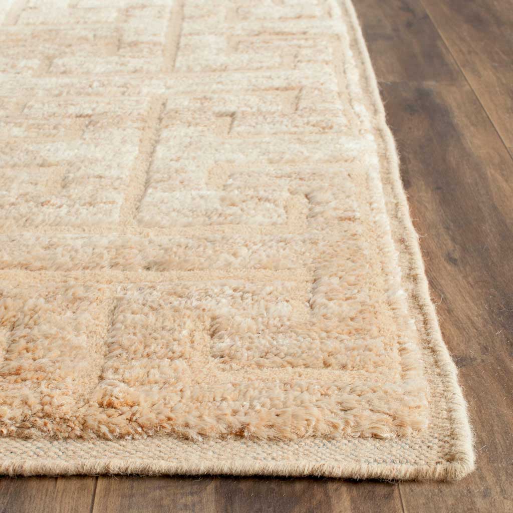 Plush ivory fibers and tonal beige lines add gentle dimension along the bound edge