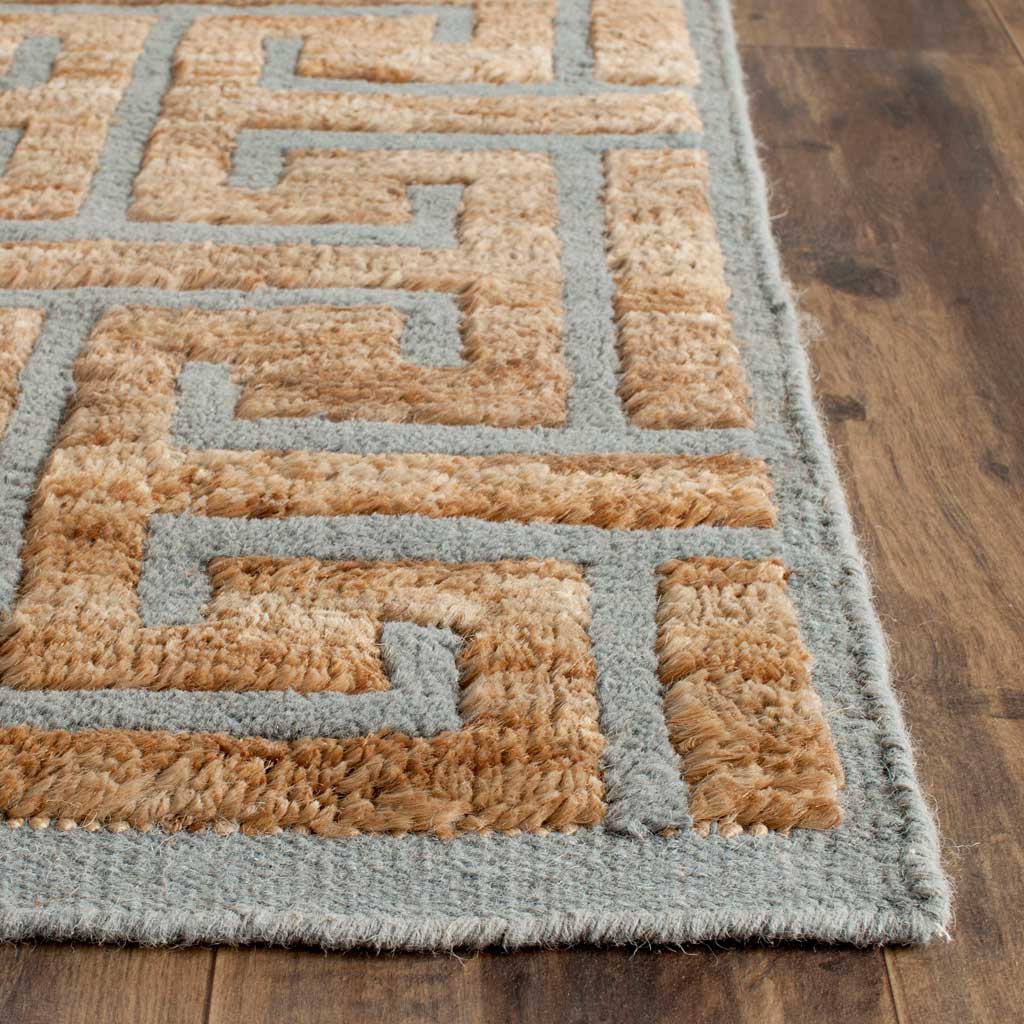 Textured beige pile frames soft gray lines and a neatly finished edge