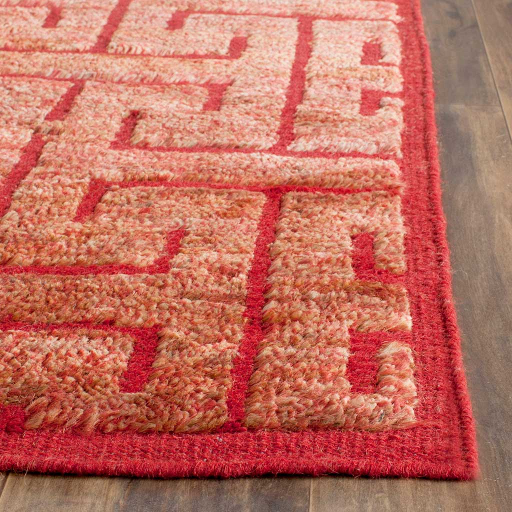 Raised rust-colored fibers contrast with vivid red lines and a neatly bound edge