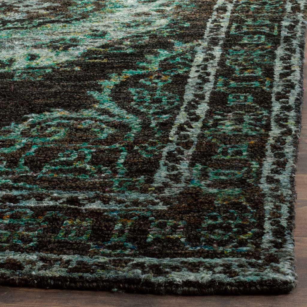 Textured pile and a finished edge highlight aqua flourishes in the deep chocolate border.