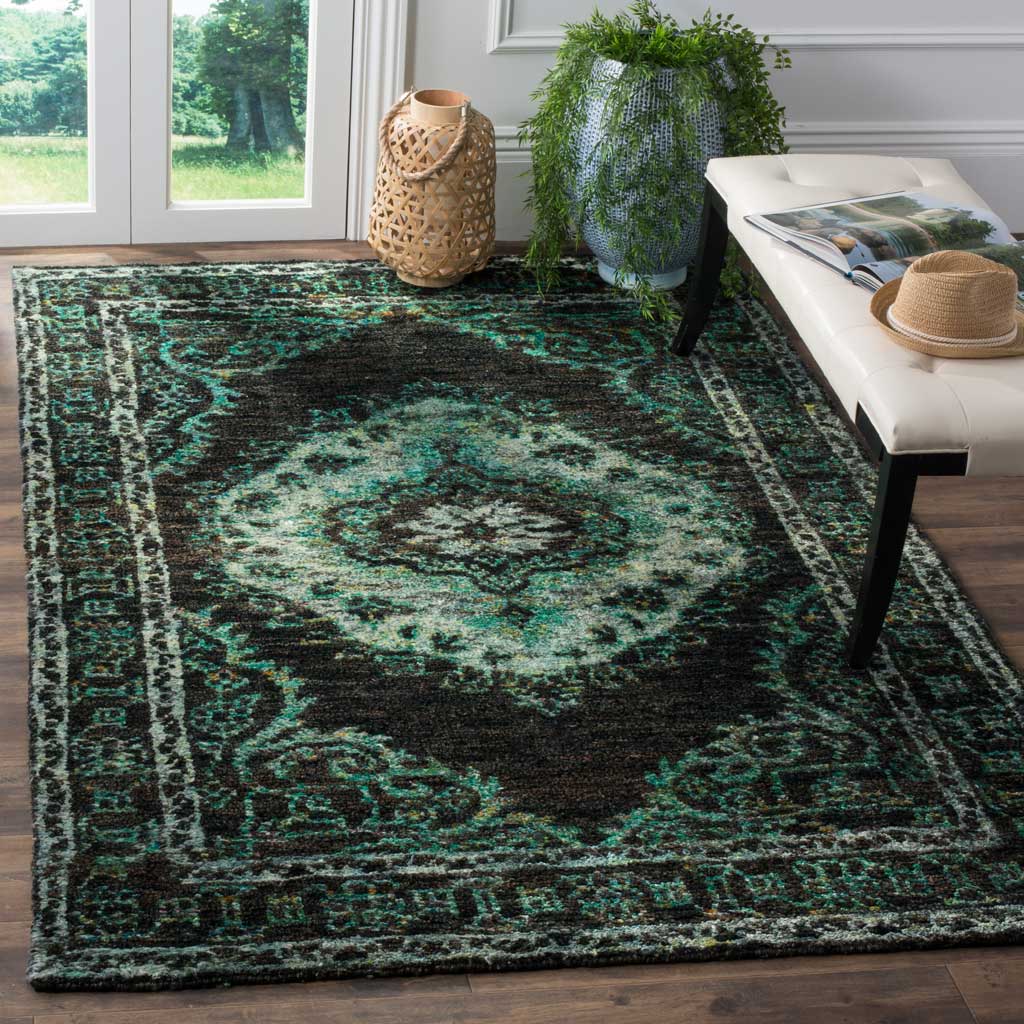 Chocolate tones, aqua flourishes, and a pale medallion lend rich contrast and texture to a living space.