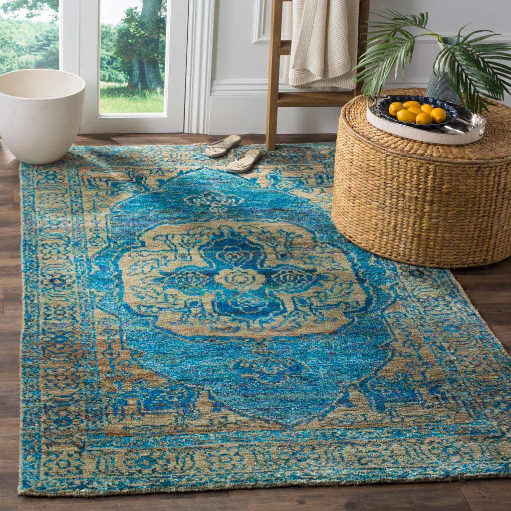 A teal medallion and detailed beige border bring colorful character to a bright living space