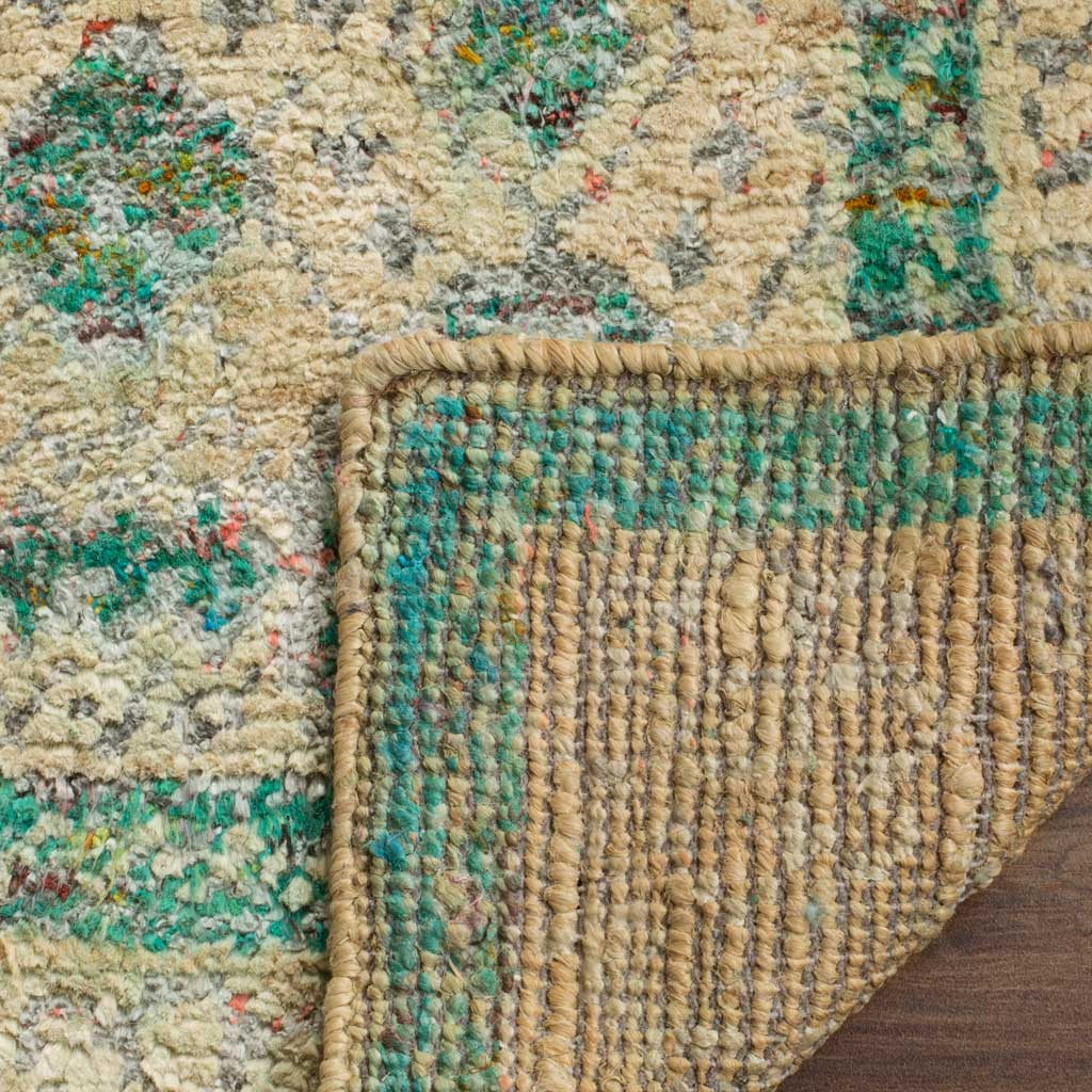 A folded edge reveals woven backing and sturdy binding beneath the patterned rug