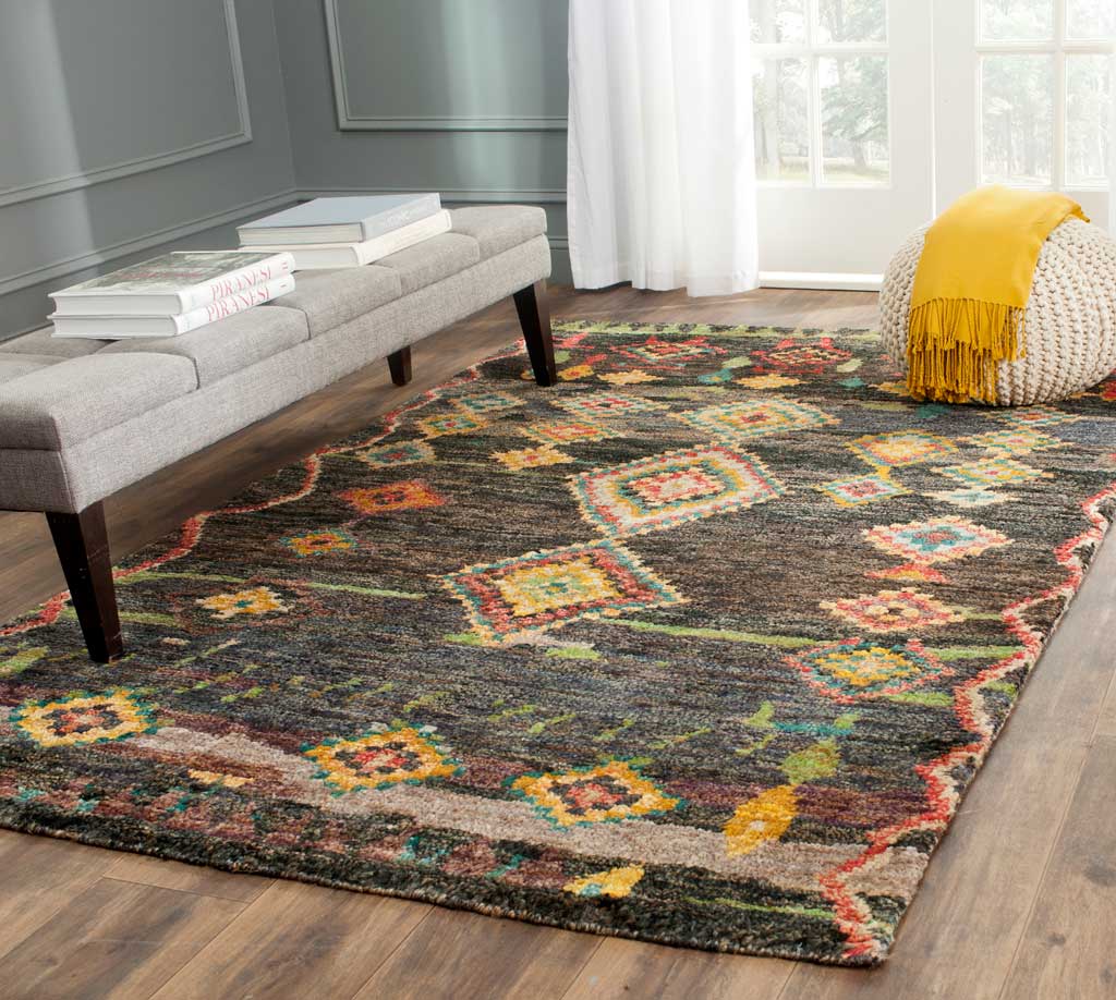 Vibrant diamond motifs enliven a dark textured rug with richly patterned edges