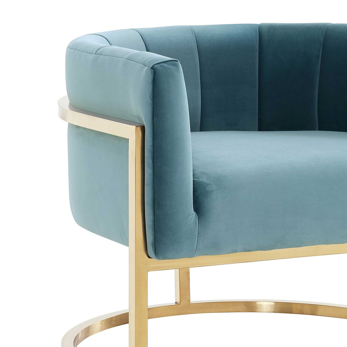 Plush sea blue velvet, neat seams, and a polished gold support accent the softly padded arm