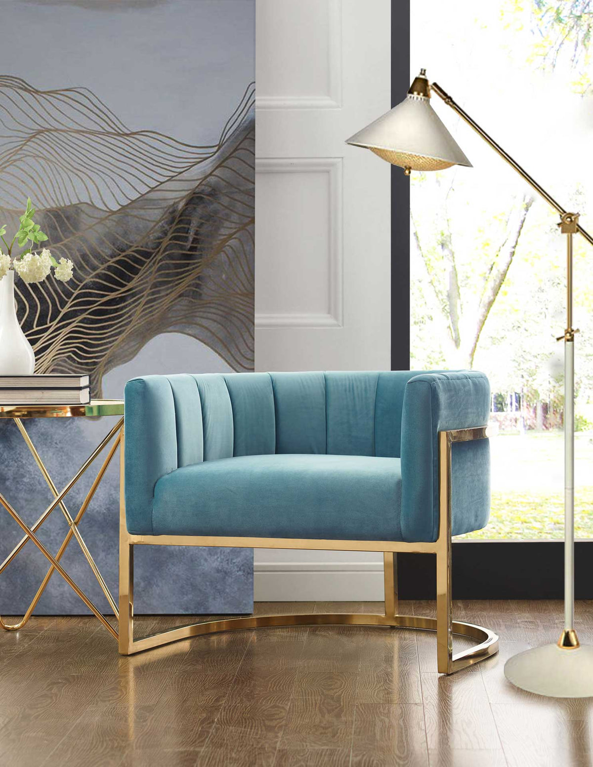 A sea blue velvet chair with a curved gold base adds soft color and polished style to a bright living space