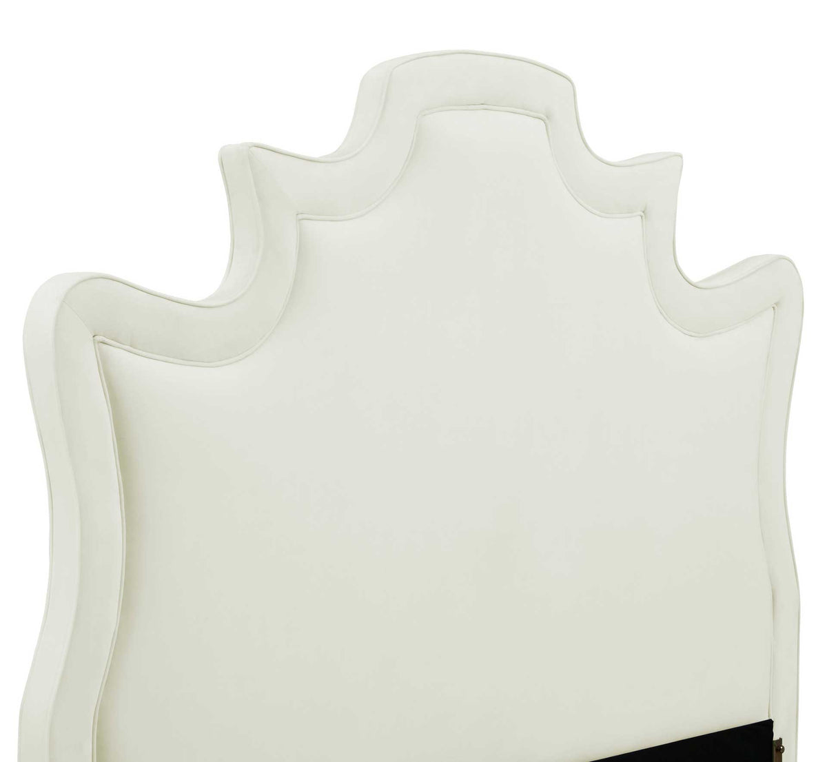 Cream velvet and piped edging highlight the headboard's graceful curves and stepped crown.