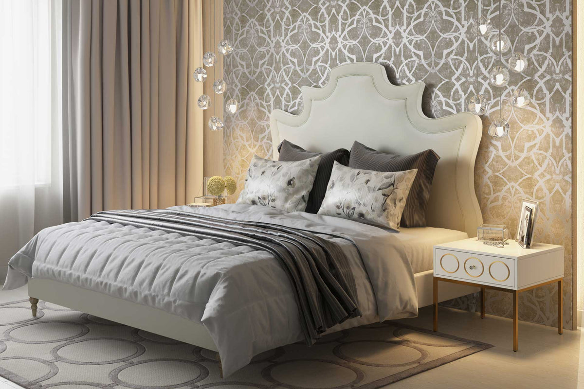 A sculpted cream velvet headboard adds romantic charm, while weathered oak legs lend natural warmth.