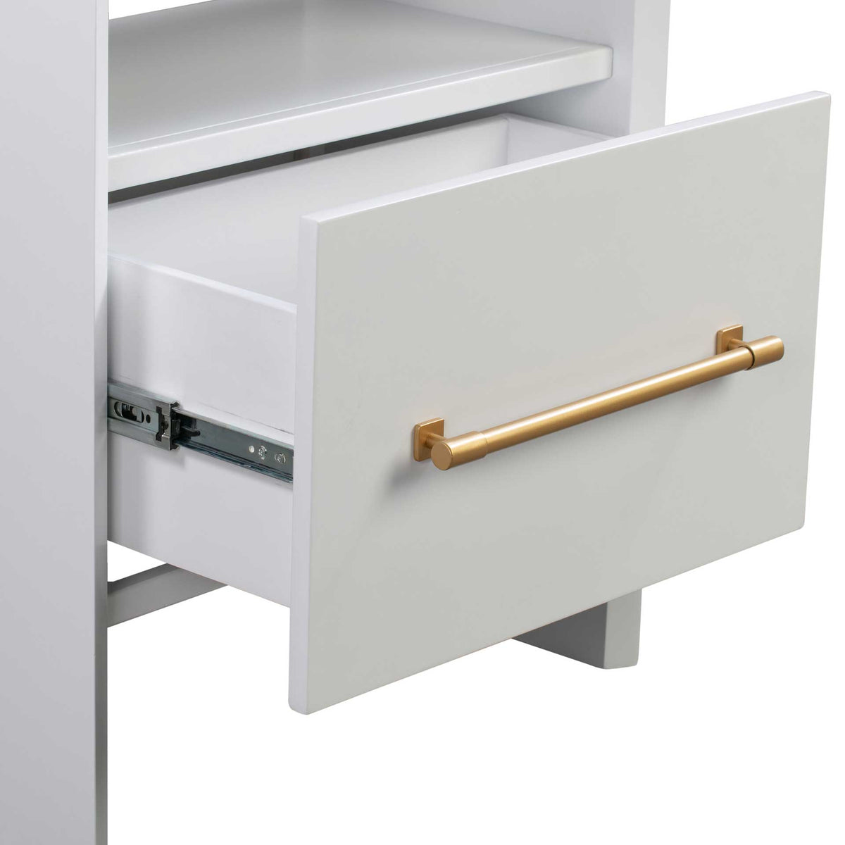 An open white drawer with metal slides and a gold-finished pull keeps essentials easy to reach