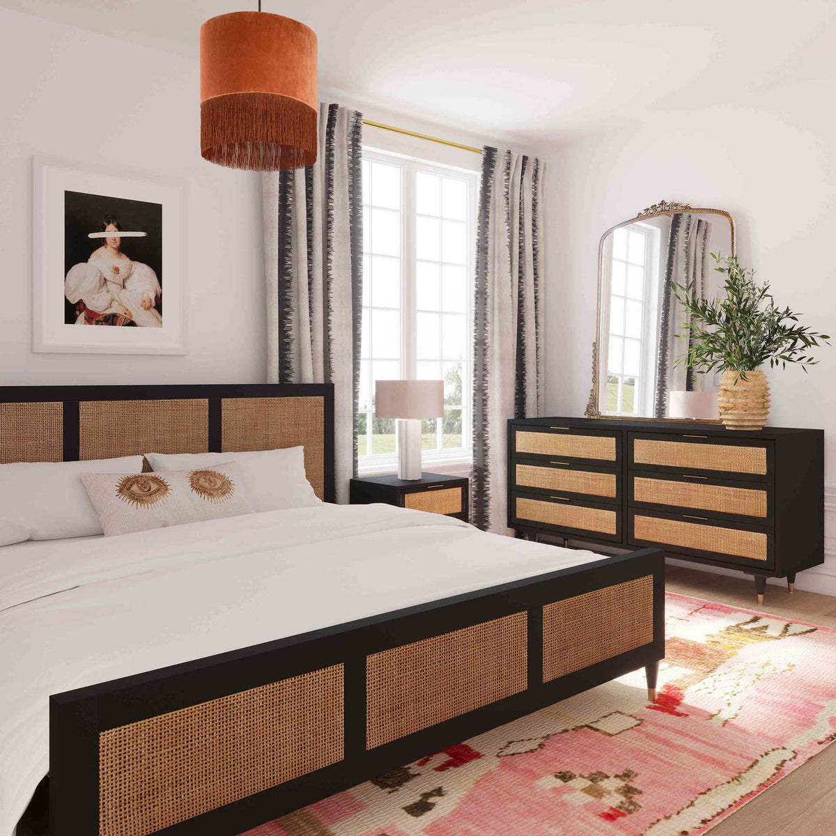 Black framing and natural cane give the matching headboard and footboard a bold boho look