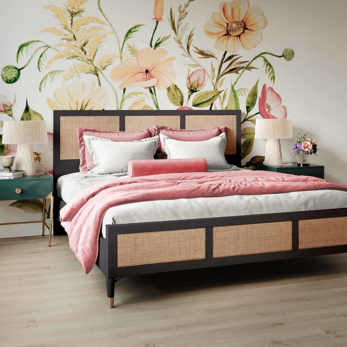 Warm cane panels soften a black bed frame, while brass-tone leg caps add a refined touch