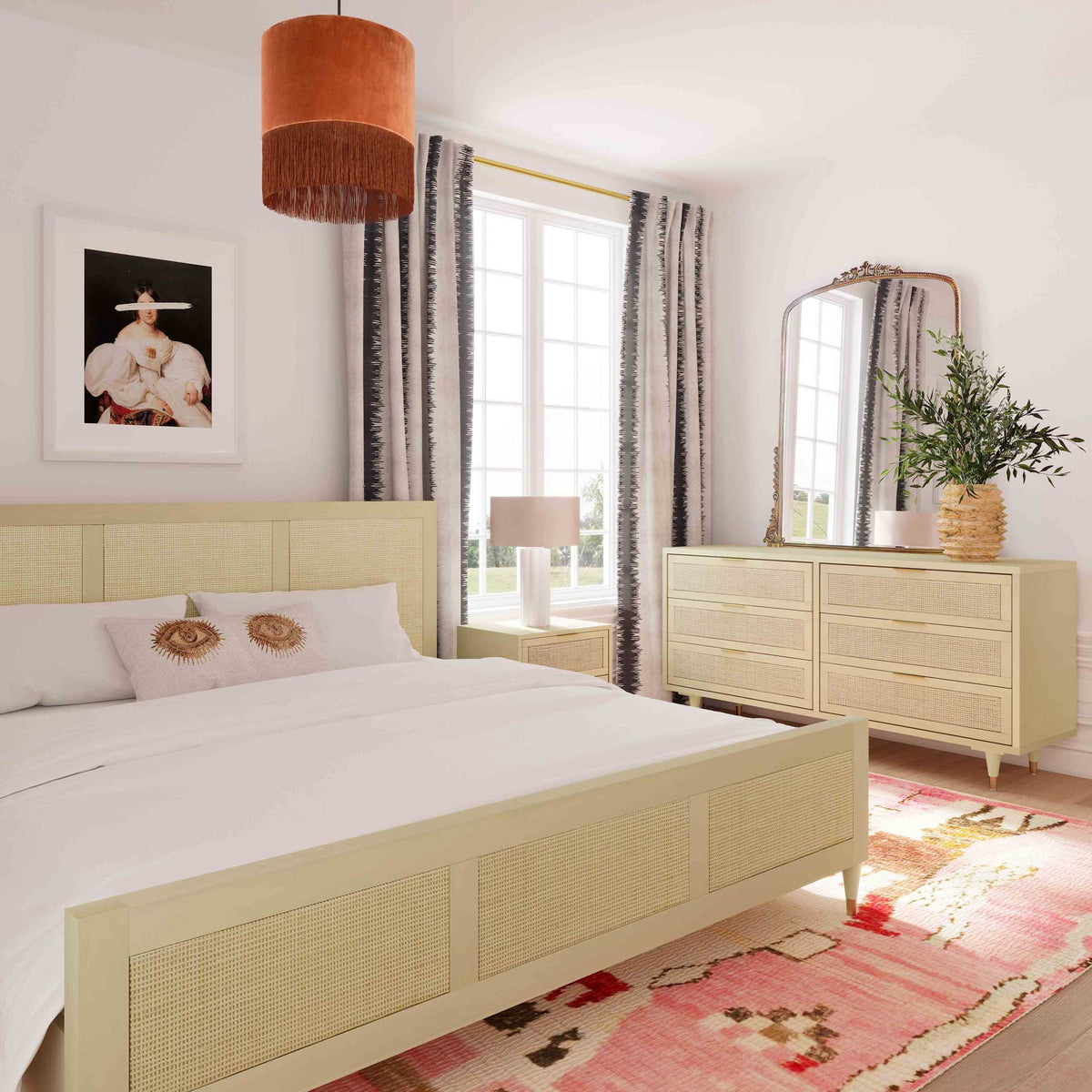 Matching cane headboard and footboard panels pair with a smooth cream frame for relaxed boho style