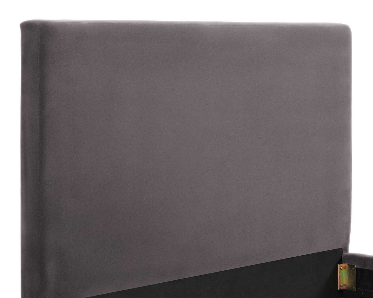 Smooth gray velvet wraps a padded headboard with clean lines and softly rounded edges.