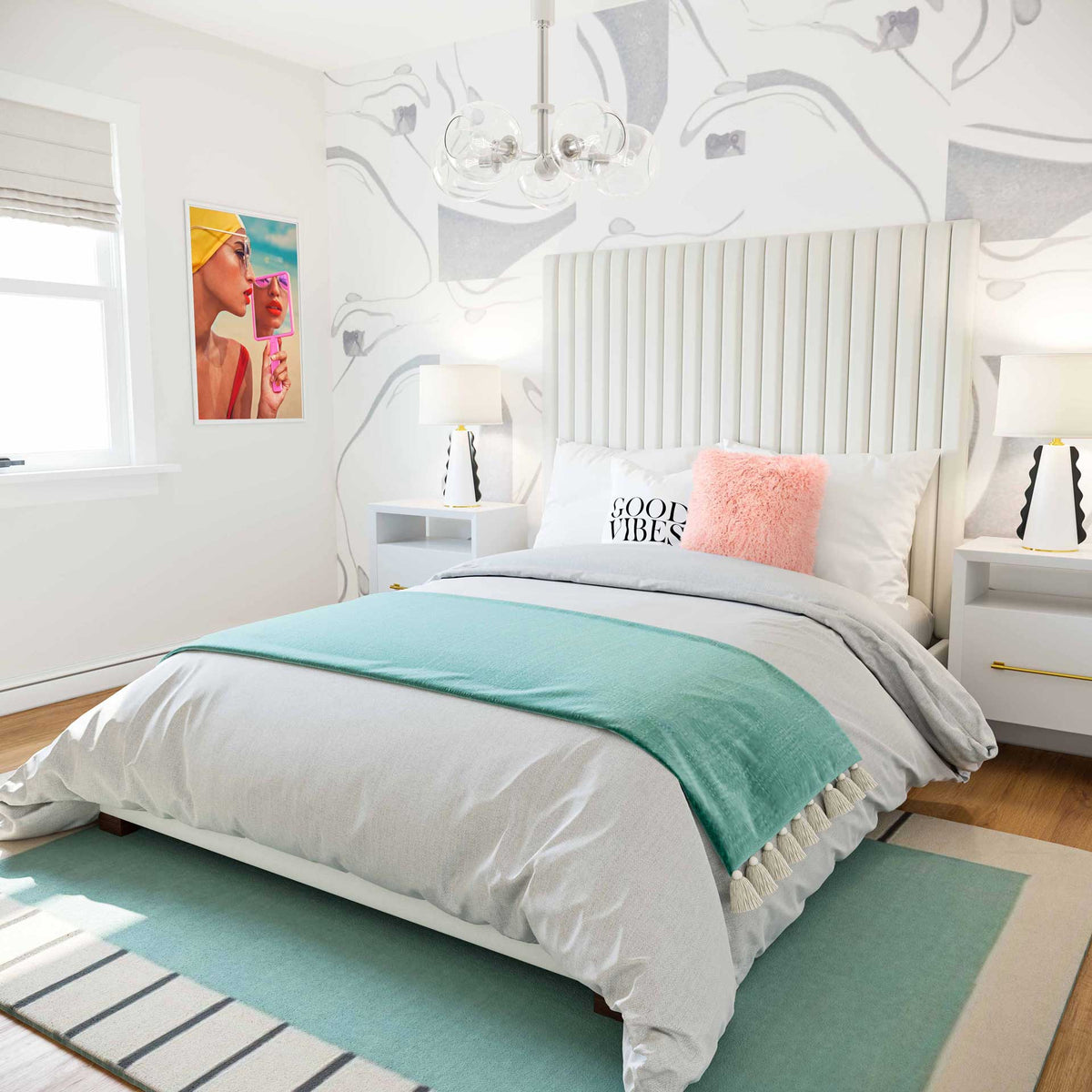 Tall white velvet channels brighten a low-profile bed styled with pastel accents and layered bedding