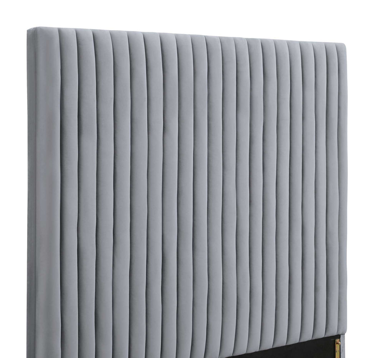 Deeply padded vertical channels bring plush texture and tailored definition to the gray velvet headboard