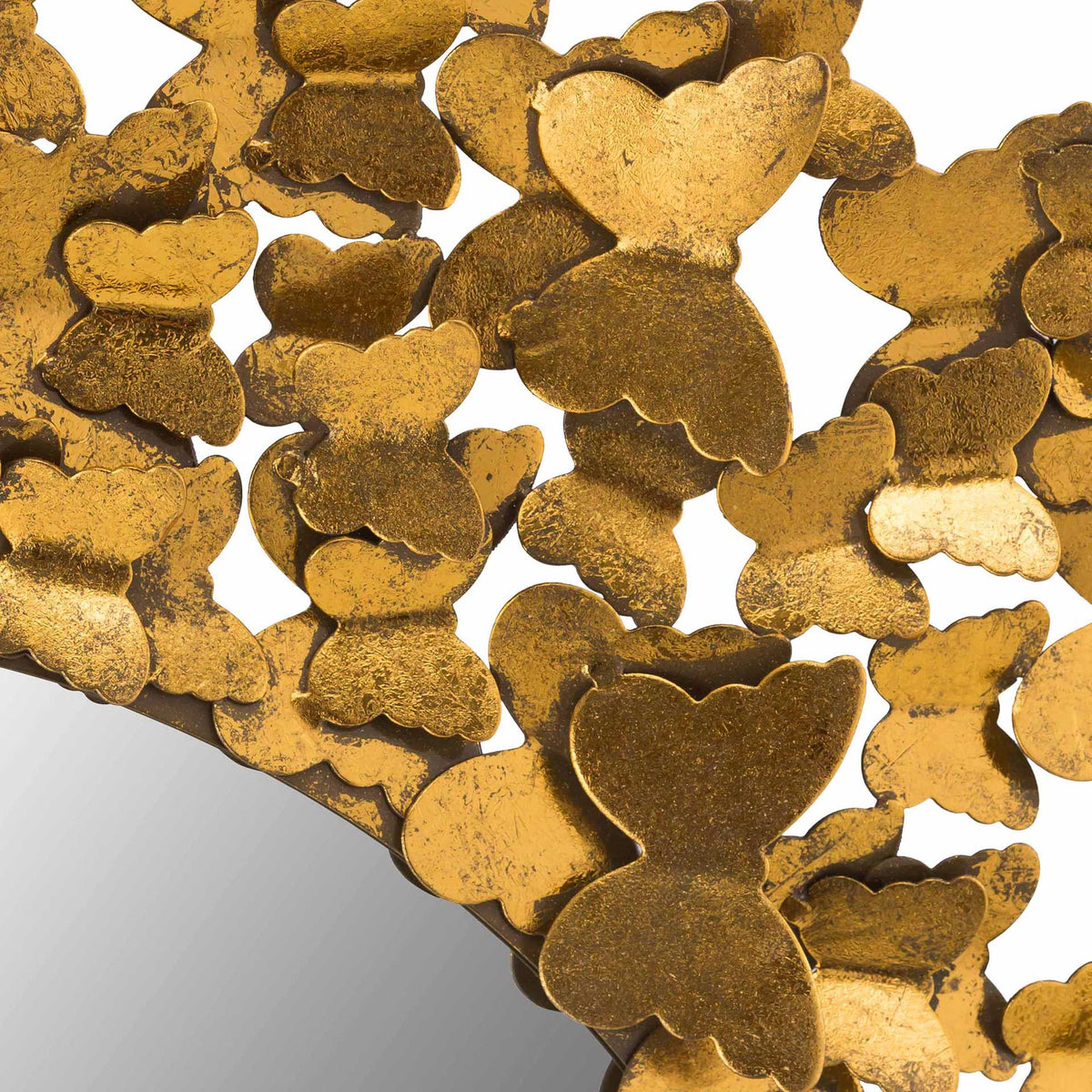 Hand-hammered gold butterfly wings showcase rich texture and softly curved edges