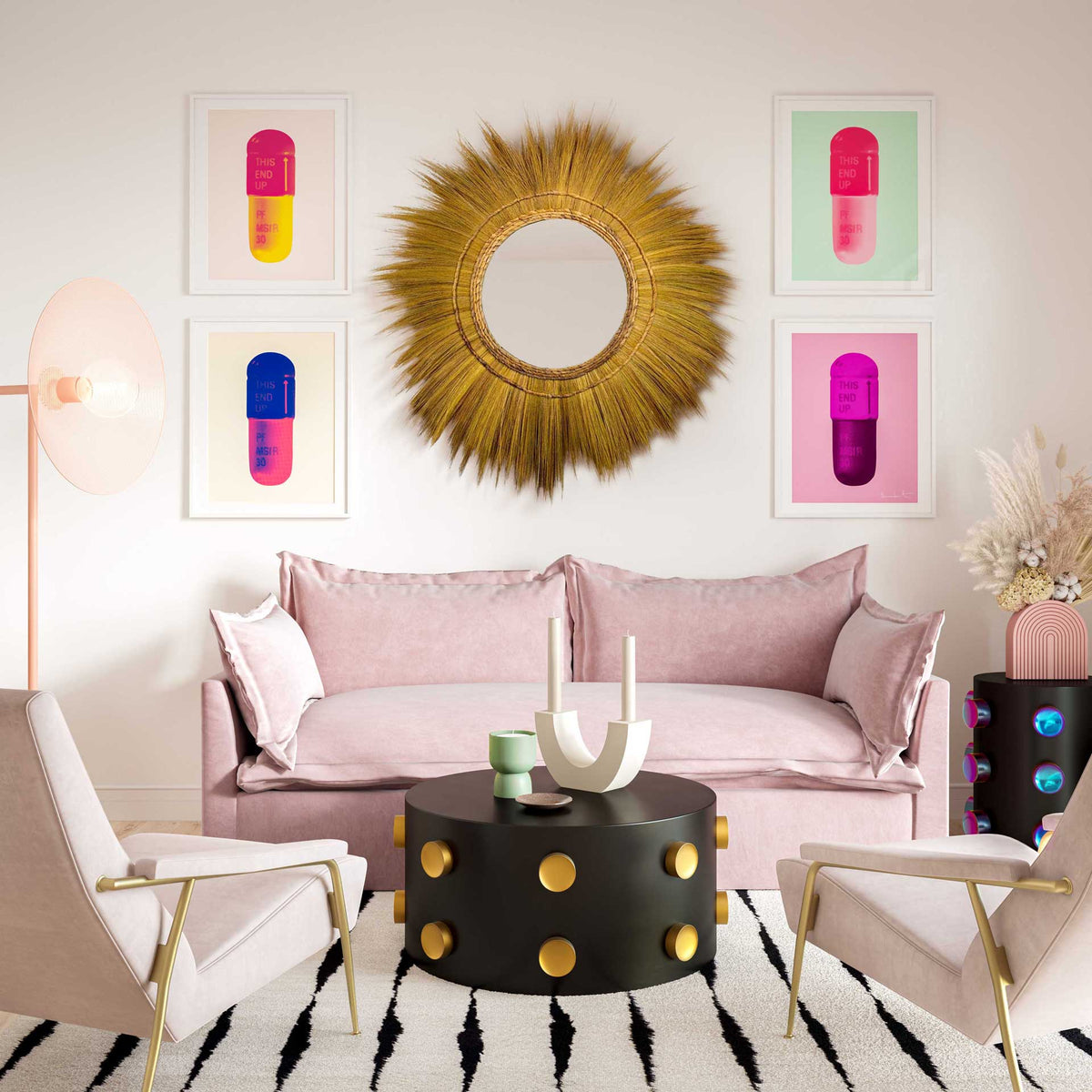 Natural grass sunburst mirror adds warmth and texture above a blush pink sofa