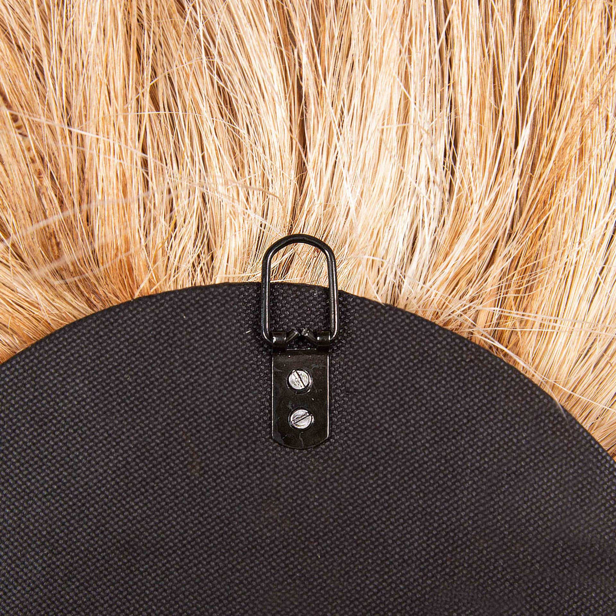 A metal hanging ring secured to the black backing makes this natural fiber mirror ready to display.