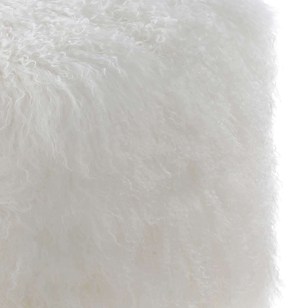 Long, curly white sheepskin gives this pouf an invitingly soft, textured surface
