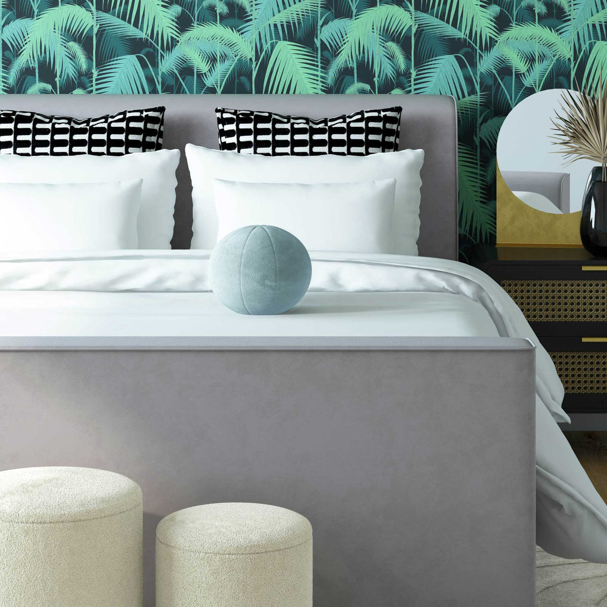 A sea blue velvet ball pillow adds a soothing pop of color against crisp white bedding