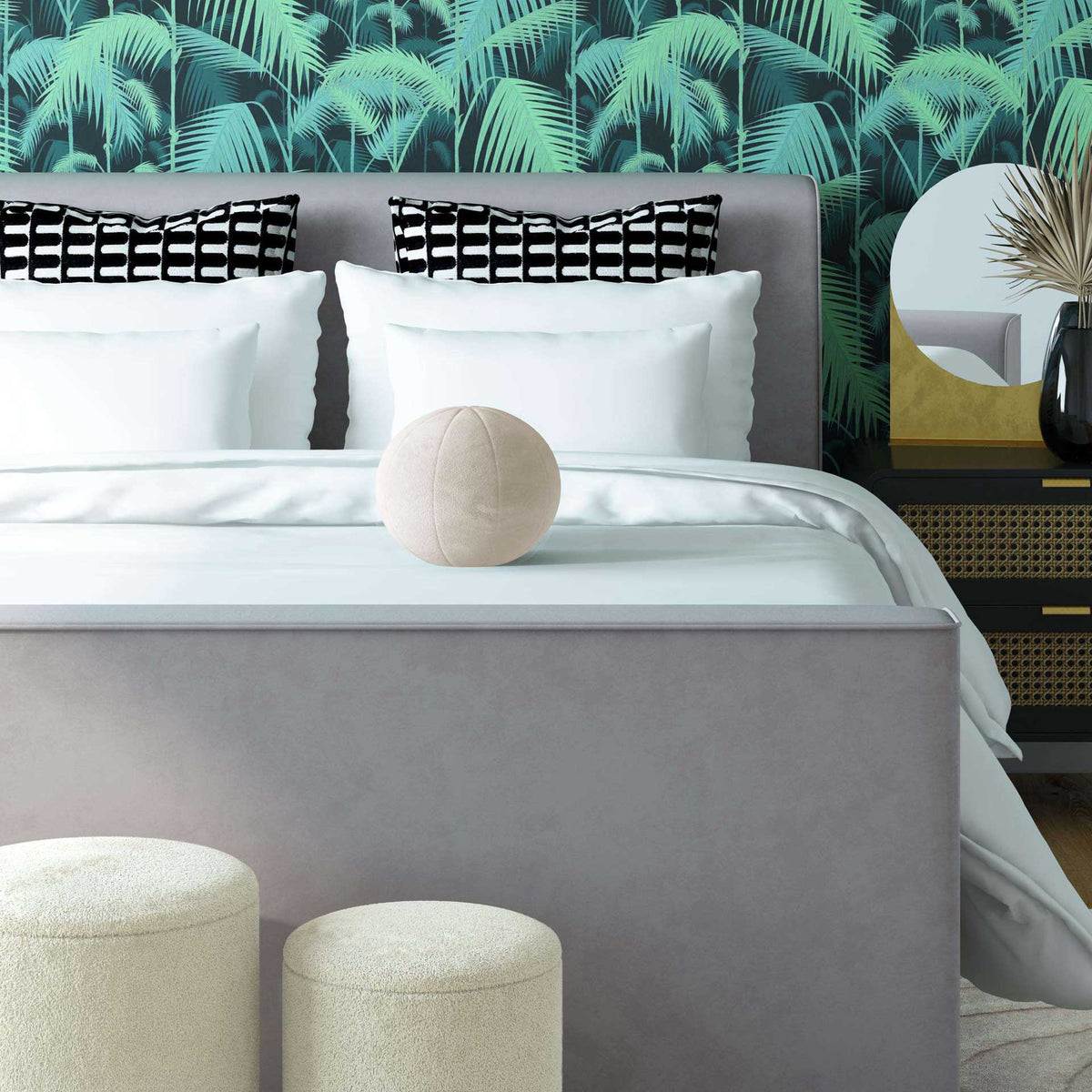 A round cream velvet pillow brings soft texture and a sculptural accent to white bedding