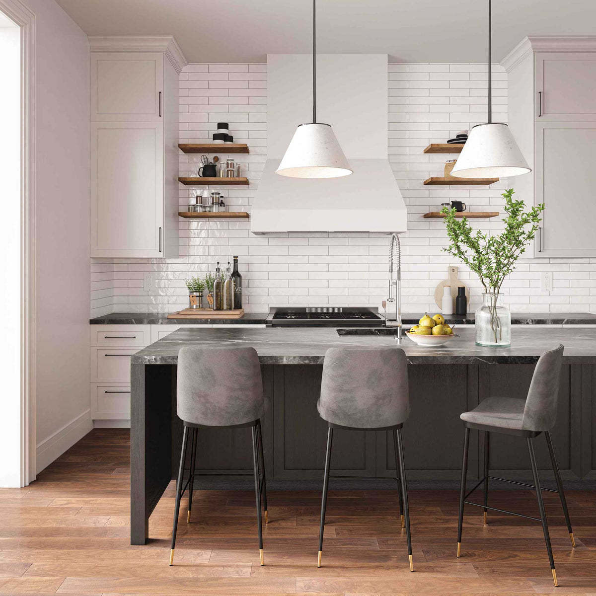 Gray velvet stools soften kitchen island seating with cushioned backs and gold-tipped black legs.