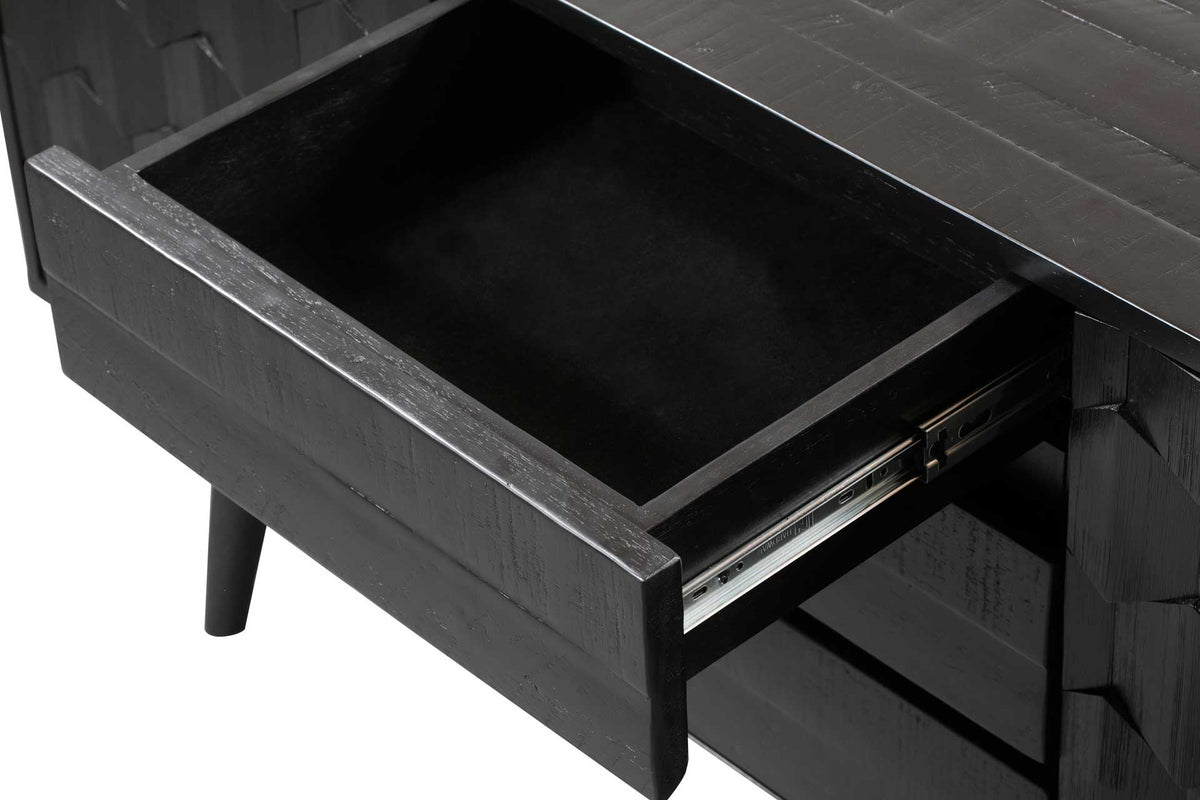 A black drawer with metal side glides offers handy storage for dining essentials.
