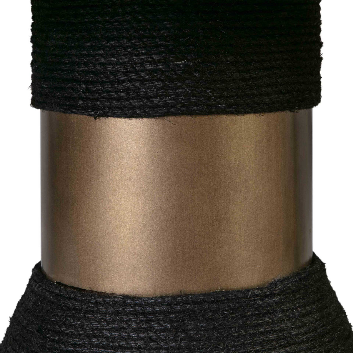 A warm metallic band provides a luminous contrast to densely wrapped black rope