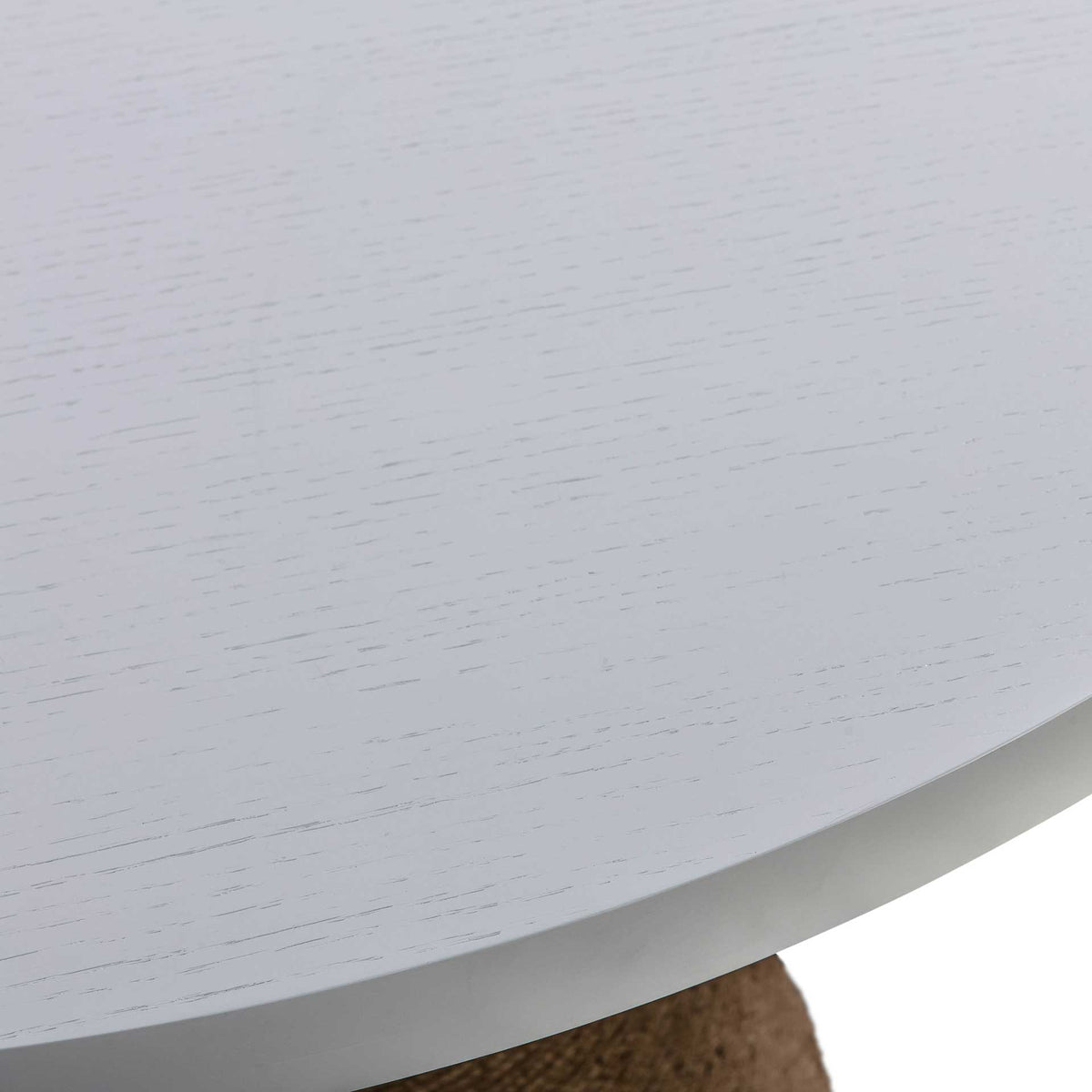 A smooth white edge frames the softly textured acacia tabletop