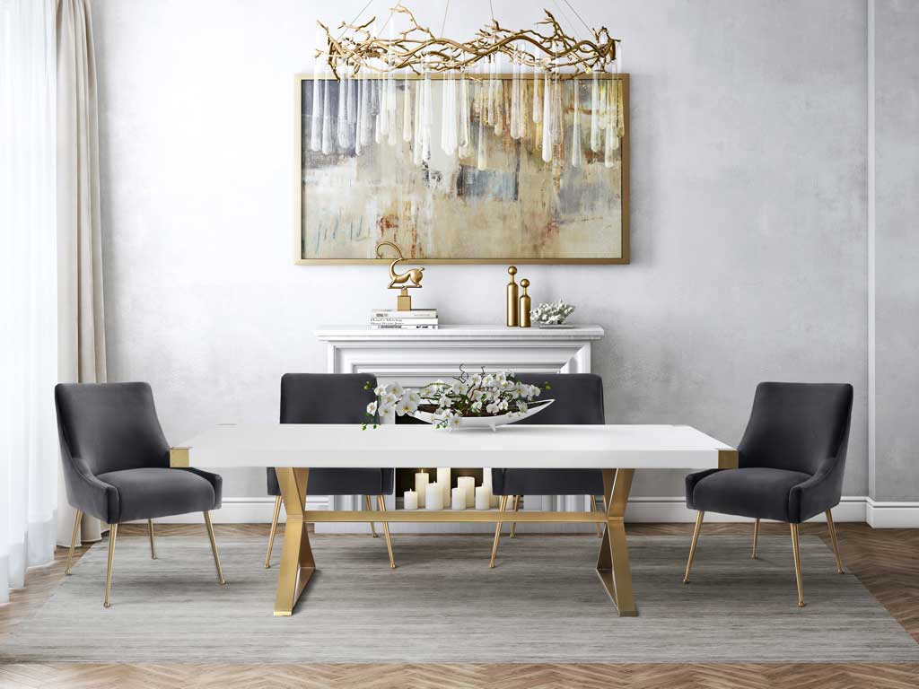 An expansive white lacquer top and gold base make this dining table a glamorous gathering spot.