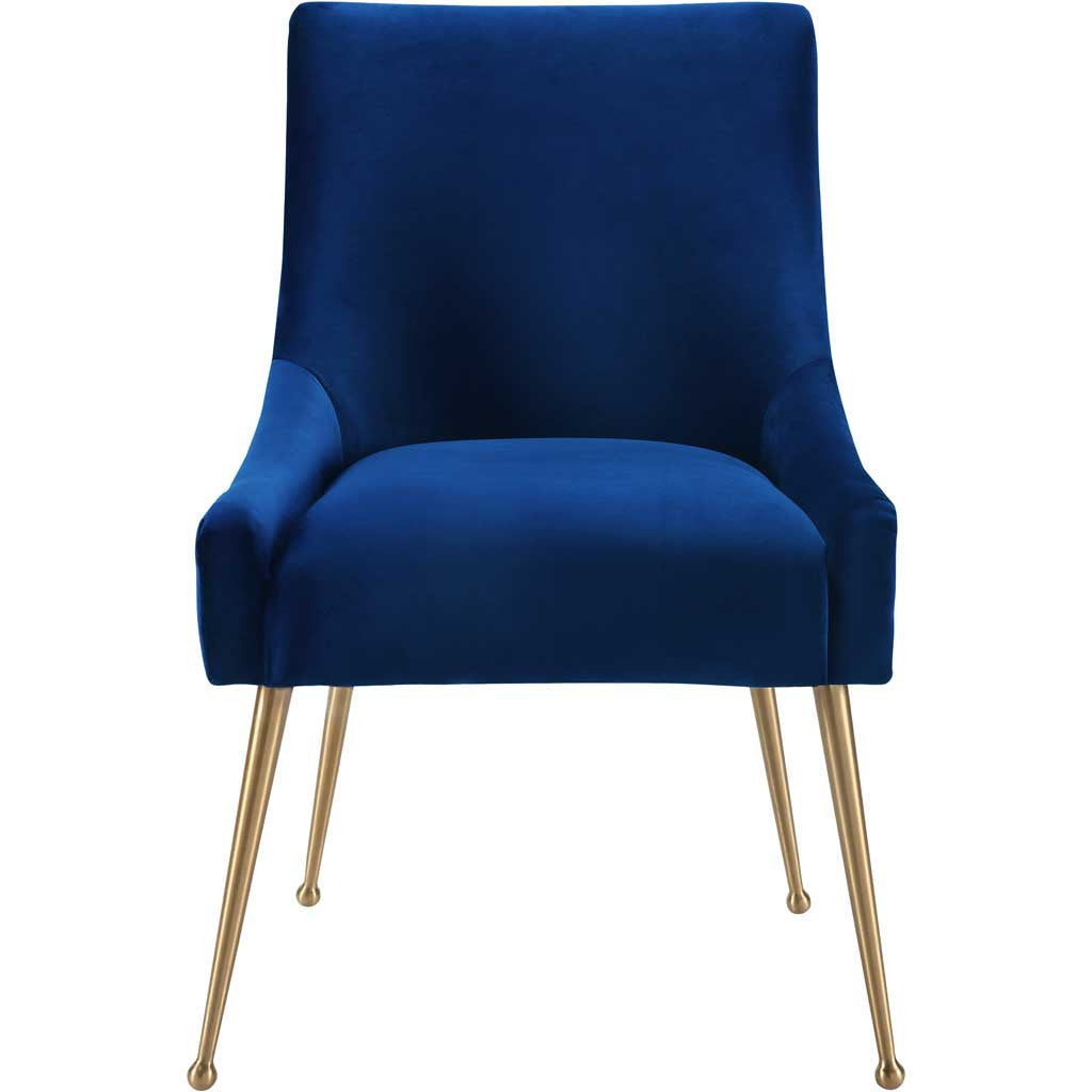 Deep navy velvet covers a cushioned seat and high curved back, complemented by tapered gold legs. || TOV-D48 || front_studio