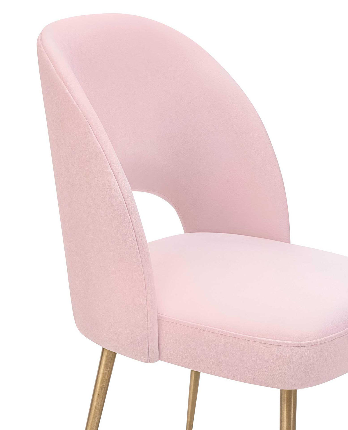 Tailored seams highlight the soft blush velvet upholstery and gently rounded seat edges