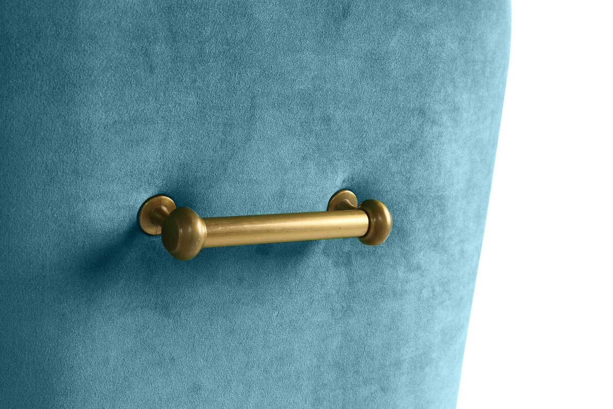 A rounded gold bar handle adds warm metallic detail to the chair's lustrous sea blue velvet upholstery.