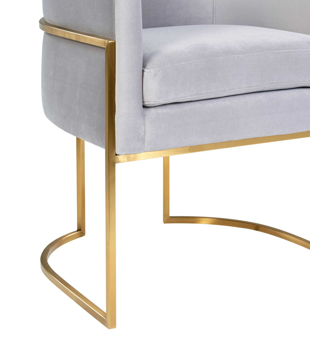 A slim gold stainless steel base adds a striking geometric contrast to soft gray velvet upholstery