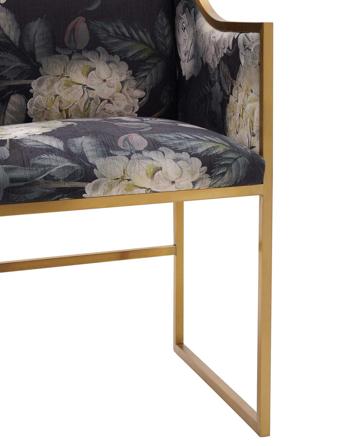 Sleek gold stainless steel sled legs support a plush seat wrapped in dark floral velvet