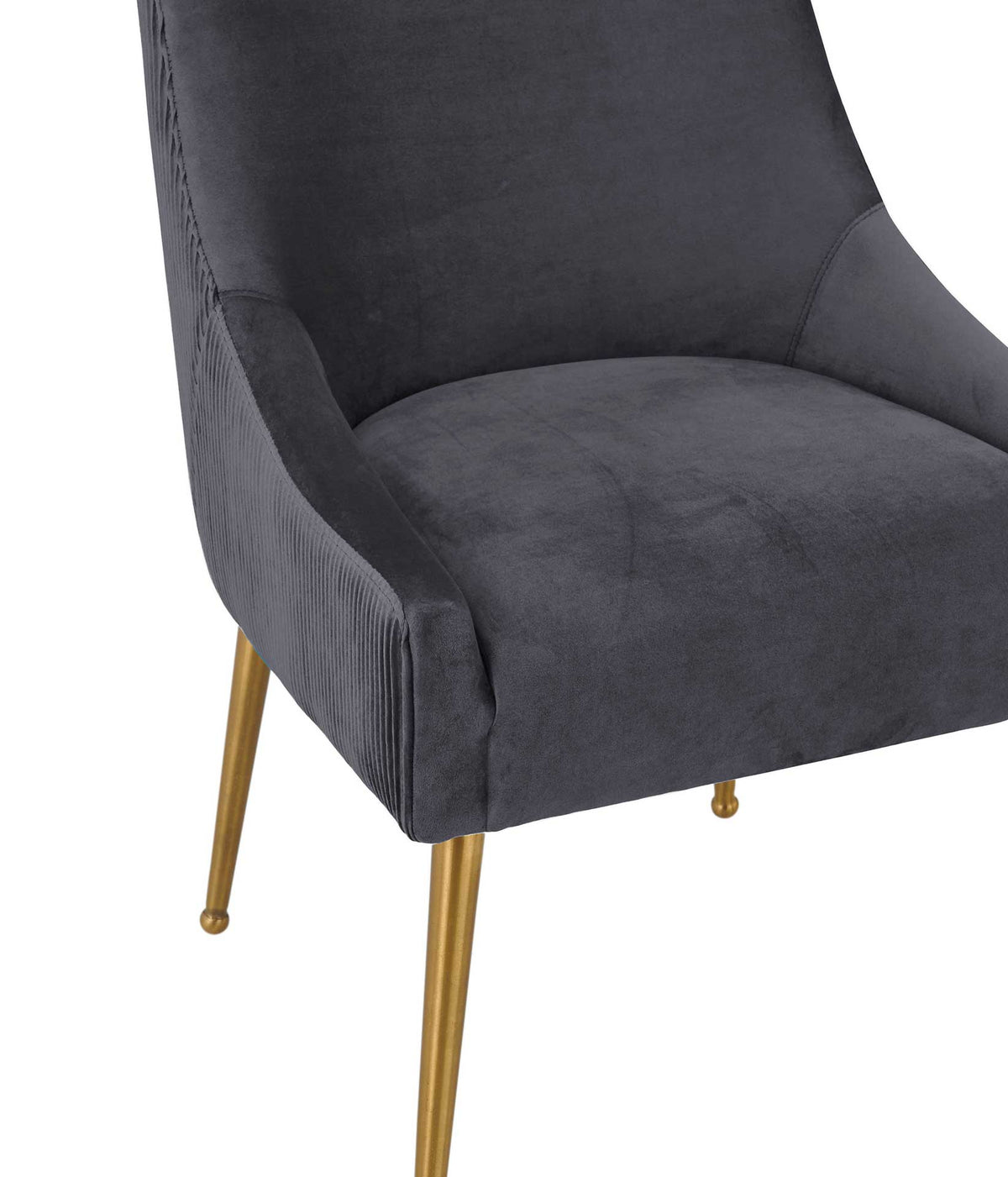Soft charcoal velvet wraps a thick cushioned seat, with sculpted sides and subtle pleated texture.
