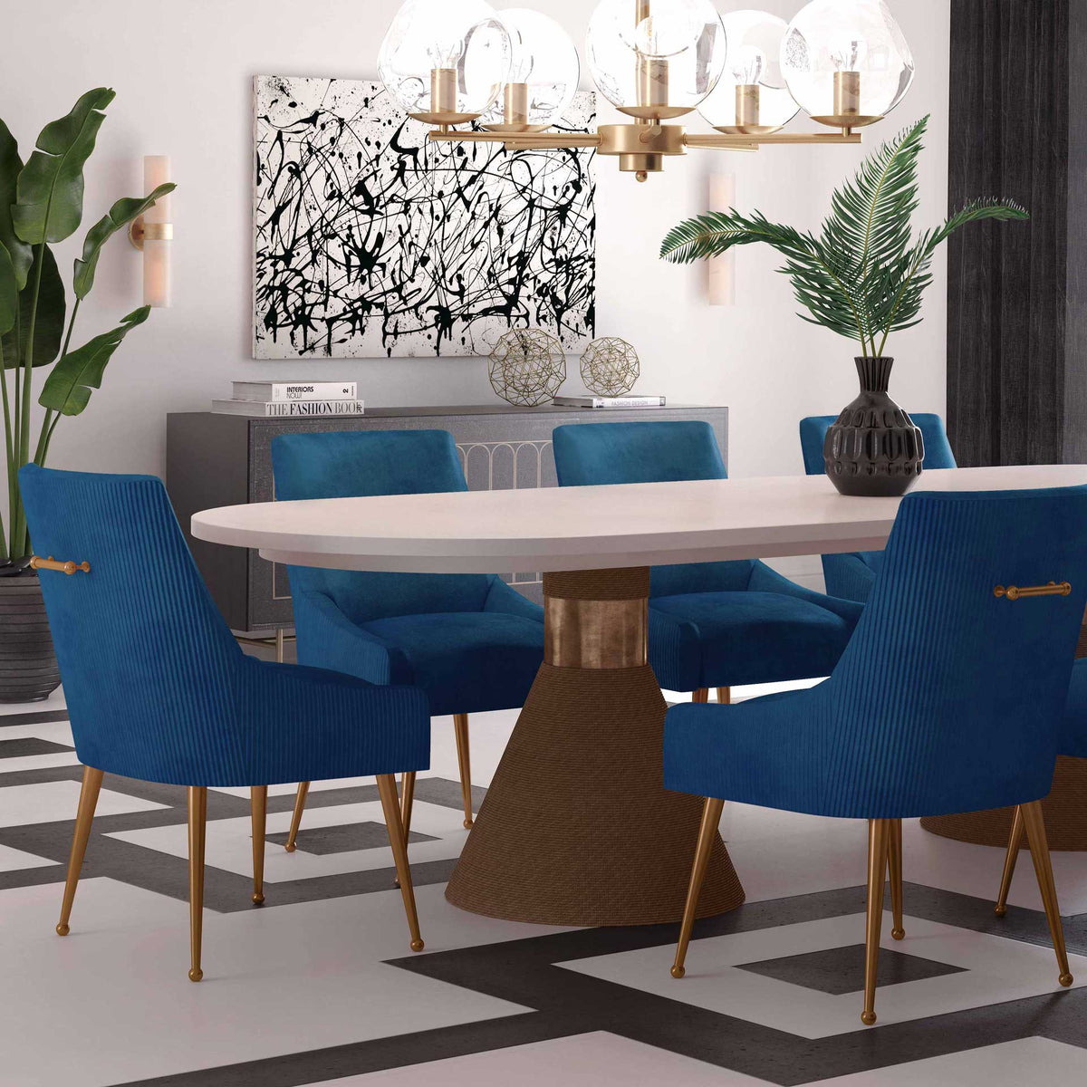 Pleated blue velvet chairs add vibrant color, sculpted curves, and gold accents to a modern dining room.