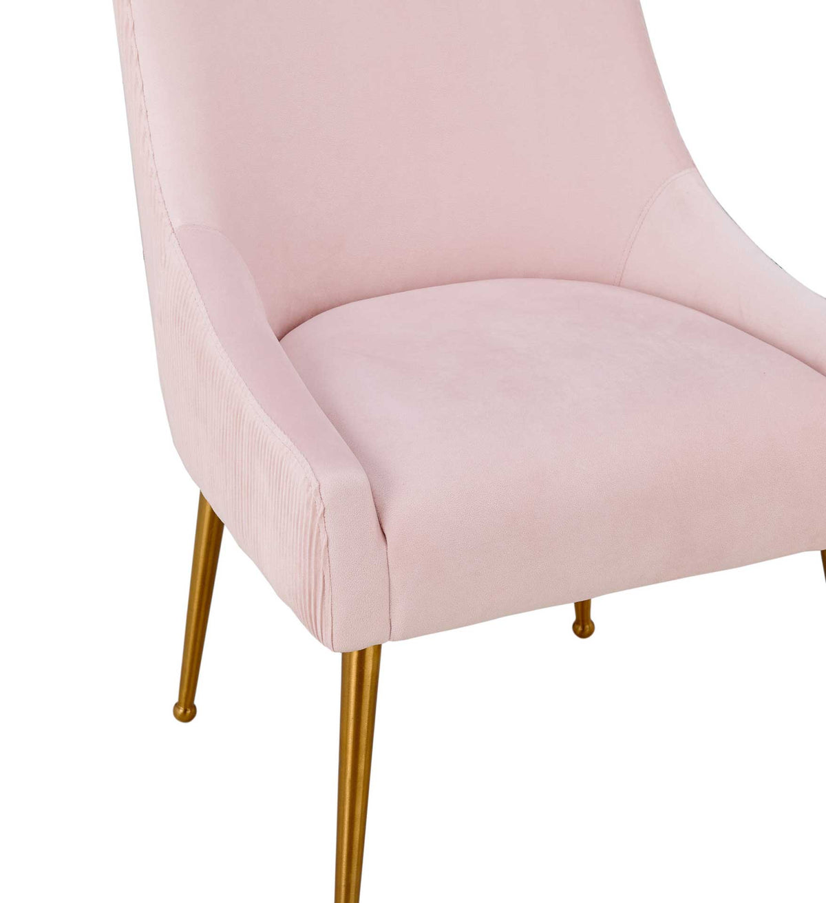 Smooth blush velvet cushions the seat, framed by curved sides with delicate pleated detailing.