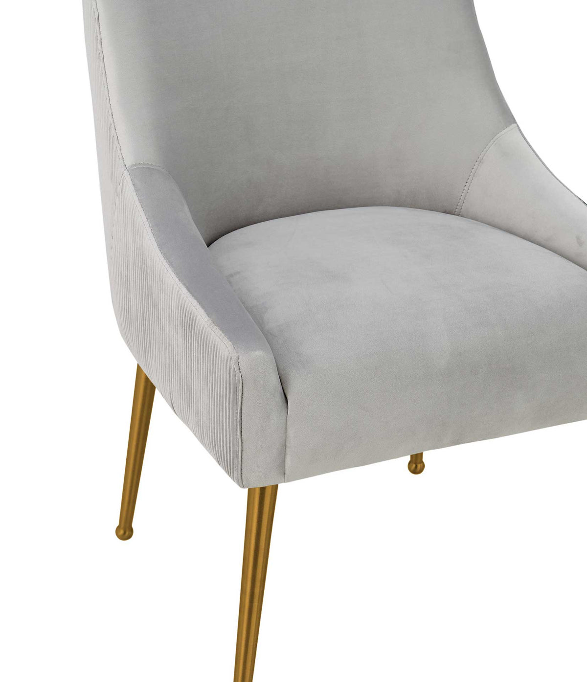 Plush light gray velvet meets tailored curved sides, with fine pleats along the chair's outer shell.