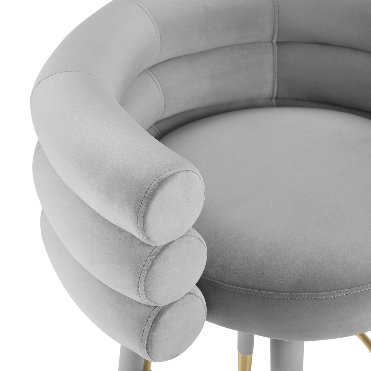Plush gray velvet and neat stitching accent the rounded bolster arms and cushioned barstool seat