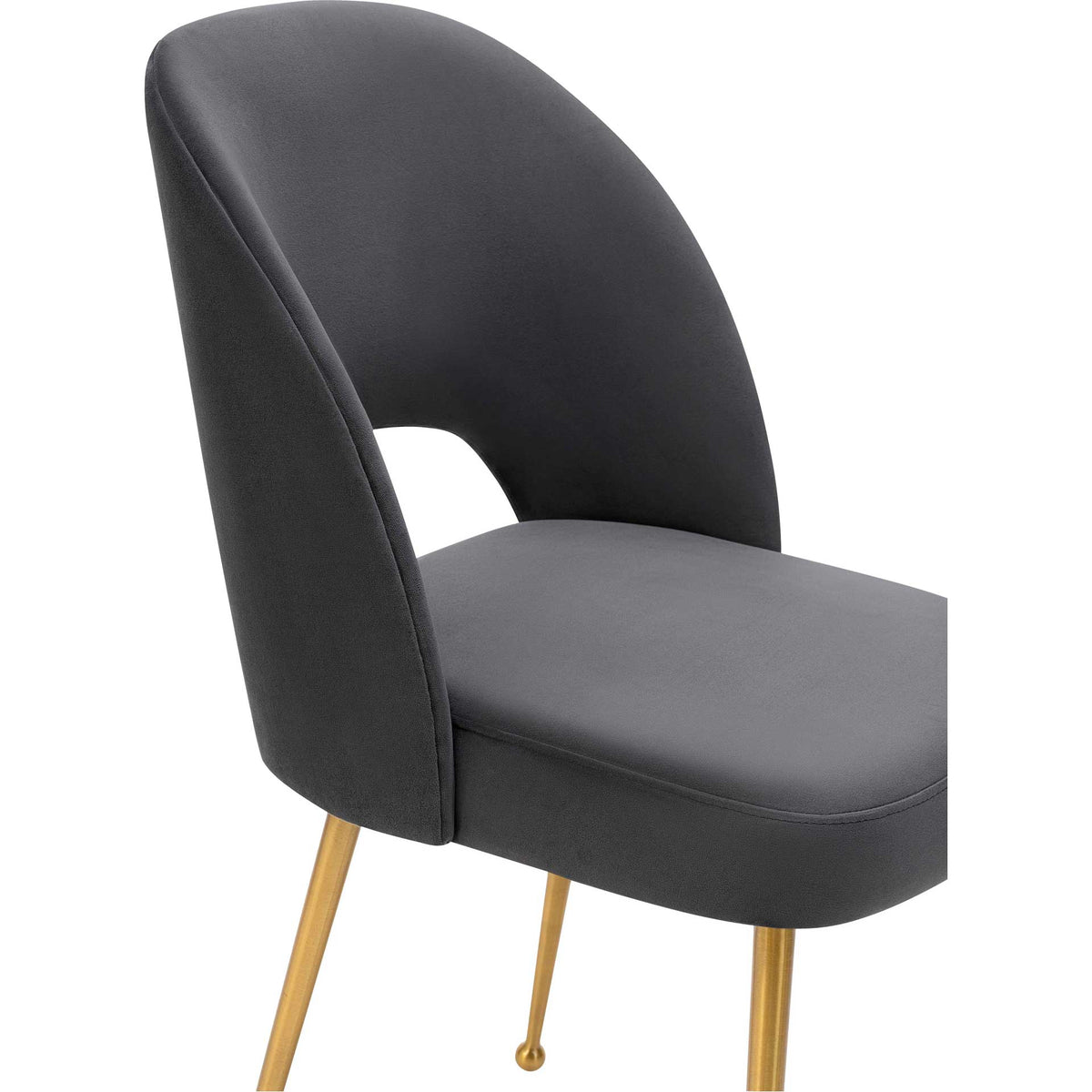 Rich dark gray velvet, stitched edges, and soft padding accent the chair's curved silhouette