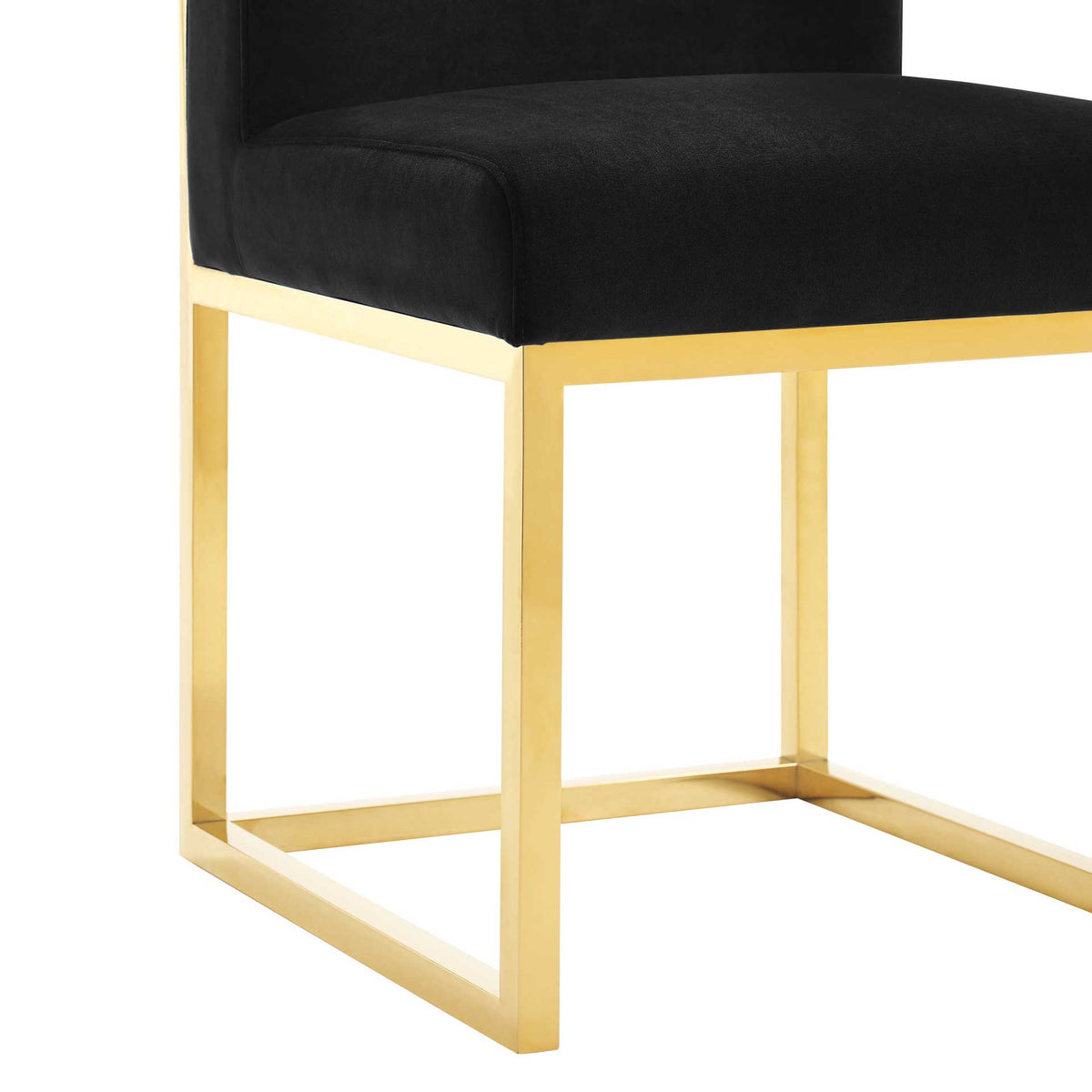Slim gold-tone steel supports form an open rectangular base beneath the plush black velvet seat