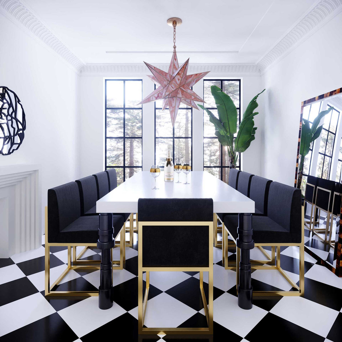 Black velvet dining chairs with gleaming gold frames bring bold contrast to a bright dining space