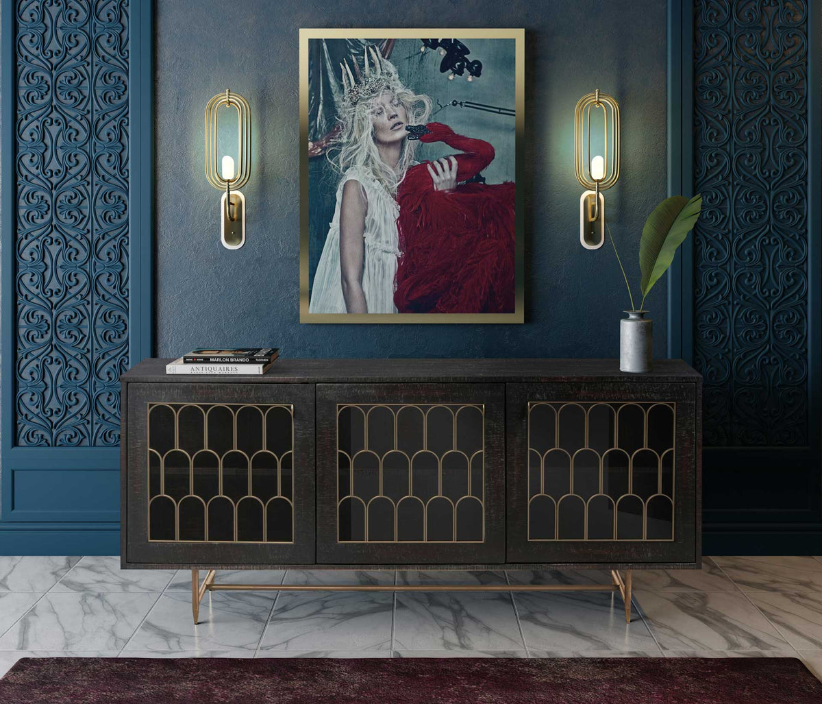 Brass-accented arches and dark wood create a striking dining room centerpiece with elegant storage.